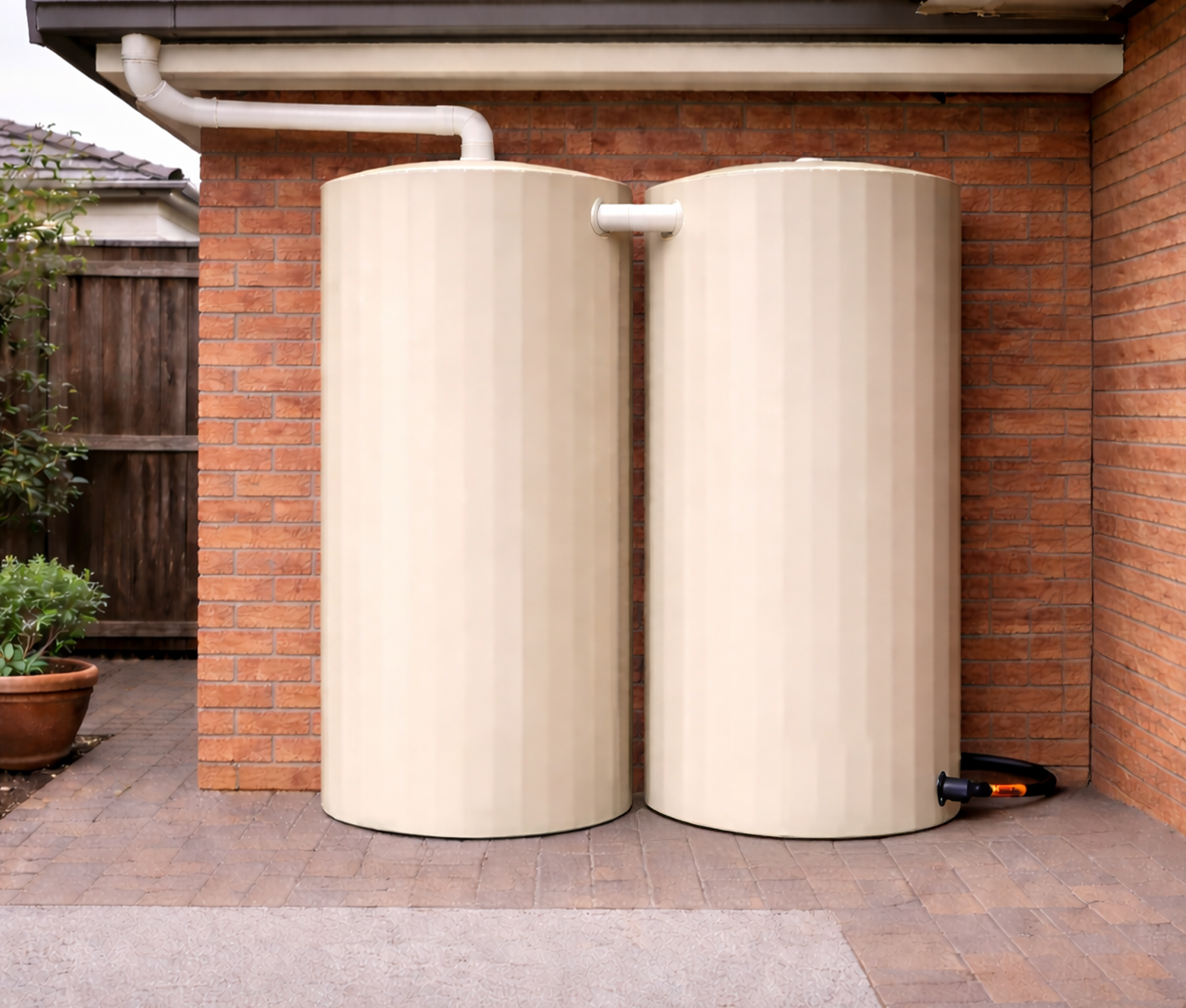 Smooth Cream rainwater tank installed beside a house